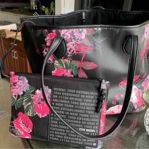 Steve Madden Black/ Pink Floral tote with wristlet. Size 22” across X 12” down.